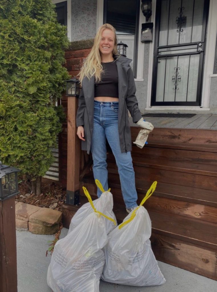 Emma Larson taking out the trash